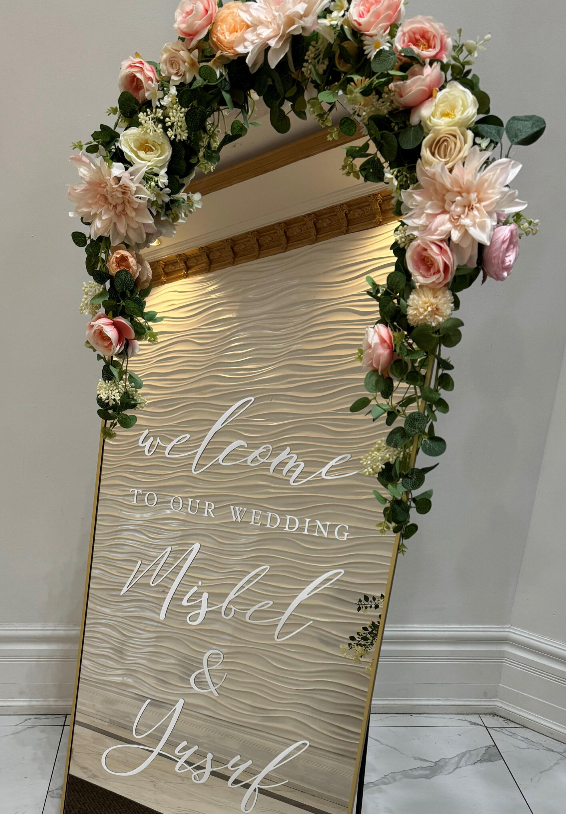 Welcome wedding mirror in Etobicoke. Wedding welcome mirror with customized vinyl writing outside a venue in Etobicoke.